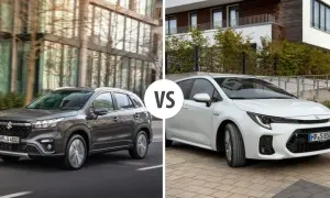 Szary Suzuki S-Cross na drodze obok białego auta.