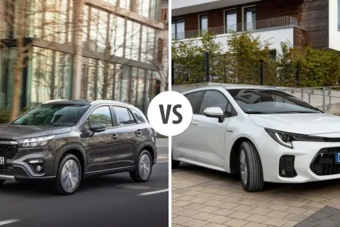 Szary Suzuki S-Cross na drodze obok białego auta.
