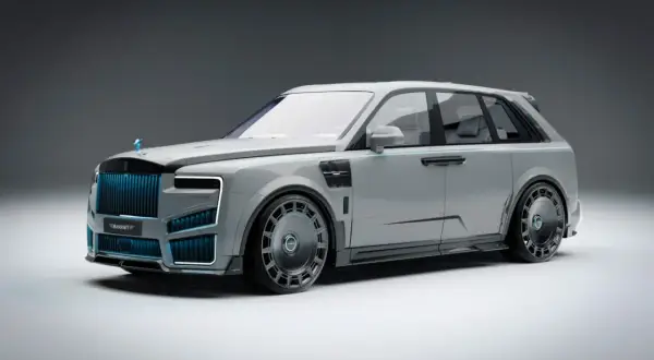 Szary Rolls-Royce Cullinan z niebieskimi akcentami i masywnymi felgami, prezentujący futurystyczny design.