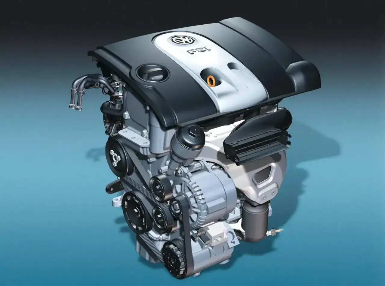 Silnik samochodowy 1.6 MPI z widocznymi paskami, alternatorem i osłoną z logo VW.